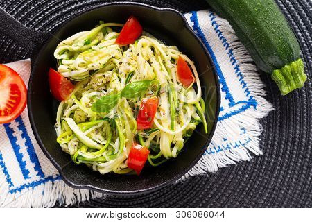 Healthy Food Concept Homemade Guilten-free Zucchini Noodles, Pasta With Tomato In Iron Skillet Pan