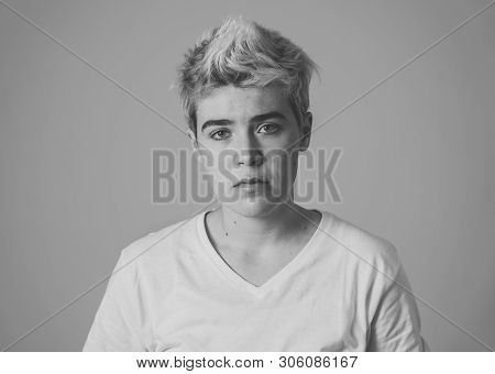 Portrait Of Good Looking Trans Teenager Man Suffering From Depression