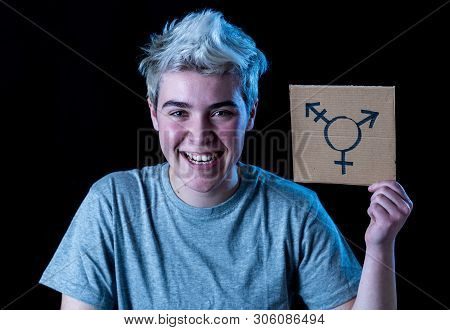 Good Looking Happy And Proud Trans Teenager Holding The Symbol Of The Transgender Drawn On A Cardboa