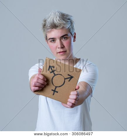 Portrait Of Happy Proud And Confident Trans Teenager Man Holding Transgender Symbol