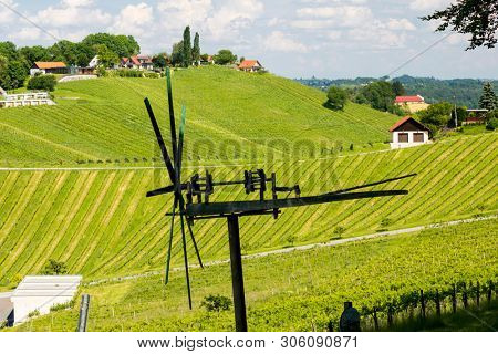 vineyard with windmill called klapotetz in south of Styria, Austria