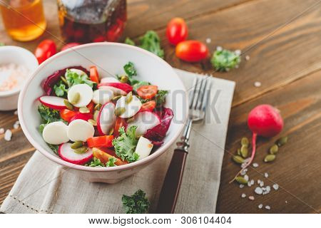 Salad From Iceberg Lettuce, Kale And Radiccio, Cherry Tomatoes, Radish, Mini Mozzarella And Pumpkin 