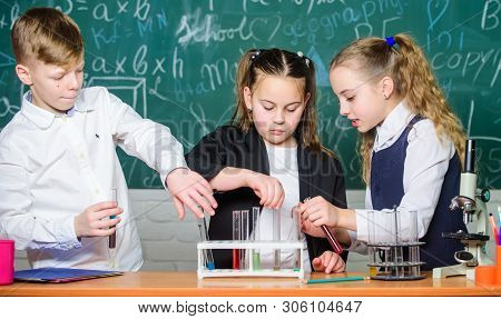 Students Doing Biology Experiments With Microscope In Lab. Little Kids Learning Chemistry. Looking A
