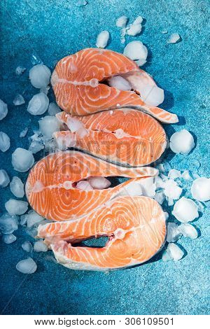 Clipping Path Fresh Salmon Steak On Concrete Blue Background With Basil And Iced. Salmon Red Fish St