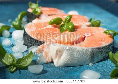 Clipping Path Fresh Salmon Steak On Concrete Blue Background. Salmon Red Fish Steak. Large Pile Of S