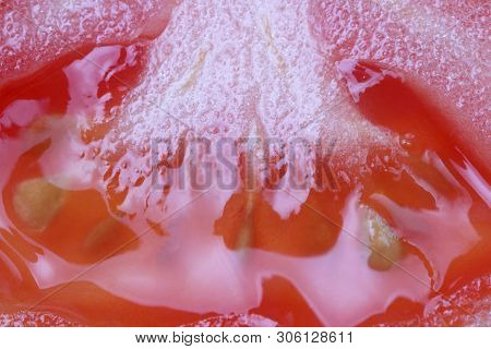 Pulp Of Tomato Closeup, As A Background, Macro Photography, Bright Juicy Color.