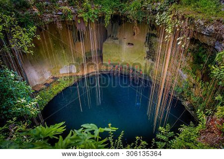 Cenote Ecoturistico Ik-kil With Blue Clear Water
