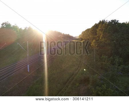 Railway In The Woods. Spying On A Passing Train. Natural Greenery Outside The City, Village Life In 