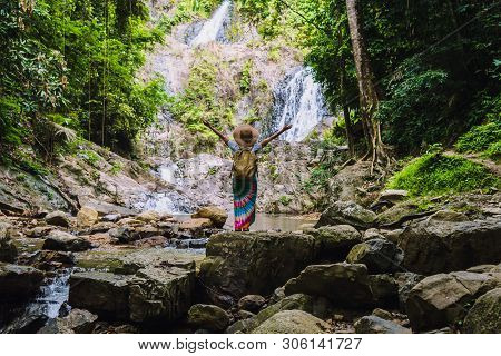 Asian Women Relax In The Holiday. Travel Waterfall On The Moutain (huai Toh Waterfall) At Krabi. Tra