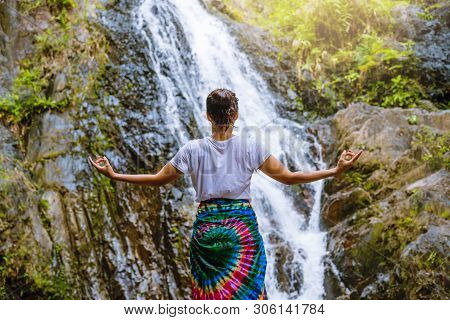Asian Women Relax In The Holiday. Play If Yoga.  Play If Yoga At Waterfall On The Moutain. Exercise,