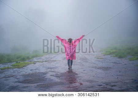 Tourist With Pink Rain Coat Stand View The Scenery Natural Beautiful Touch Fog At Phu Hin Rong Kla N