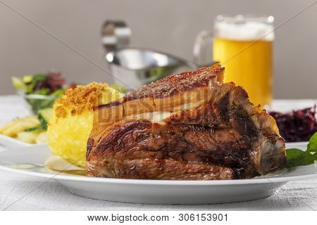 Grilled Frankonian Schaeufele With Dumpling And Beer