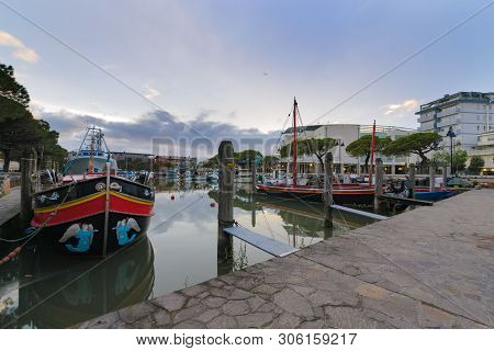 Inside Harbor With Colored Traditional And Fish Boats