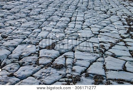 East Quantoxhead Beach In Somerset. The Limestone Pavements Date To The Jurassic Era And Are A Parad