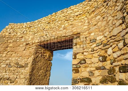 Historical Stone Arch And A Clear Blue Sky. From Muttrah, Muscat, Oman.