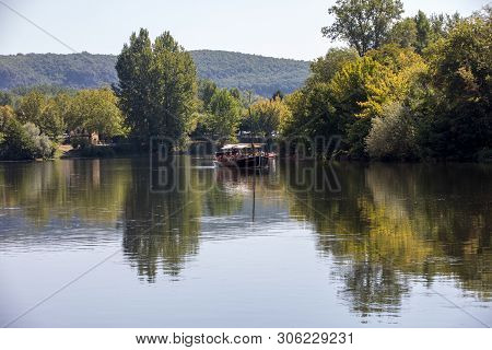 Beynac Et Cazenac, Dordogne, France - September 4, 2018: A Tourist Boat, In French Called Gabare, On