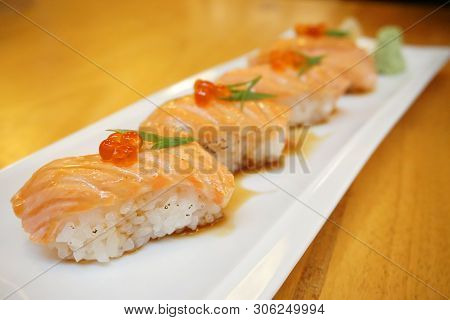 Grilled Salmon Sushi - Set Of Salmon Aburi Sushi Topped With Sweet Sauce And Salmon Roe (ikura), Tra