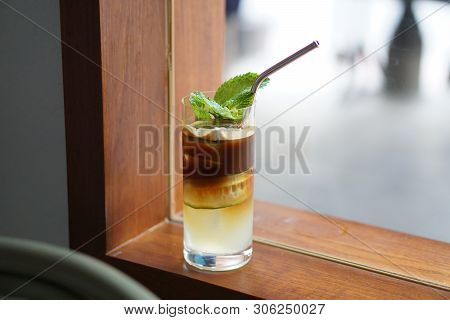Iced Coffee Shakerato - A Plastic Glass Of Espresso Shot Mixed With Craft Soda, Guava Juice And Slic
