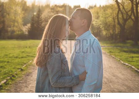 A Young Couple Spends Time Together Outdoors. Couple Having Fun Summer Time.