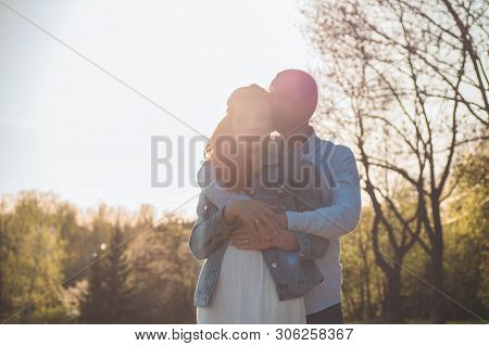 A Young Couple Spends Time Together Outdoors. Couple Having Fun Summer Time.