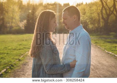 A Young Couple Spends Time Together Outdoors. Couple Having Fun Summer Time.