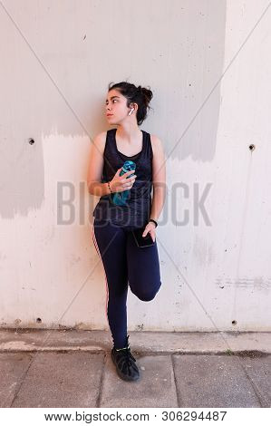 Tview Of Teenager Taking A Break After Training