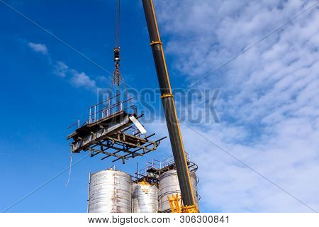 Crane Is Bringing Down Part Of Heavy Metal Construction In Industrial Complex.