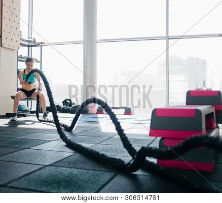 Strong Young Woman Doing Exercises For Functional Training In The Gym. Cross Training