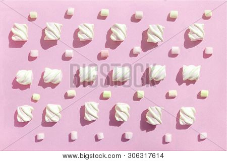 Sweet Beze, White Marshmallows On Pink Background. Pastel Color Dessert. Top View, Flat Lay.