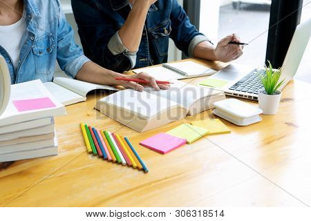 Woman And Man Work On The Table