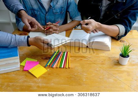 Woman And Man Work On The Table