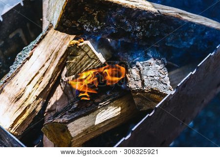 Only He Took Appeared The Fire Among The Wood-fire In The Grill