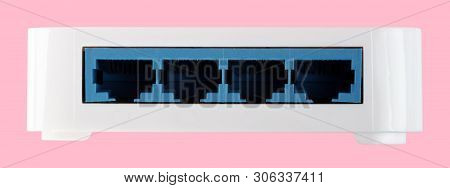 White 8 Port Plastic Ethernet Switch Isolated On Pink Background At Dry Day