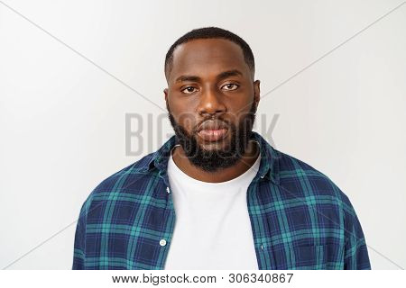 Head Shot Of An Angry African-american Man Looking Sharply Towards The Camera.
