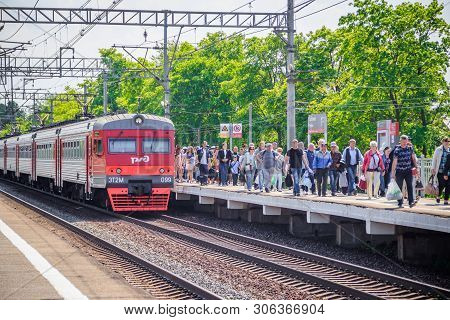 People Got Off The Train. . The Train Has Arrived. People Walk On The Platform. Russia, Leningrad Re