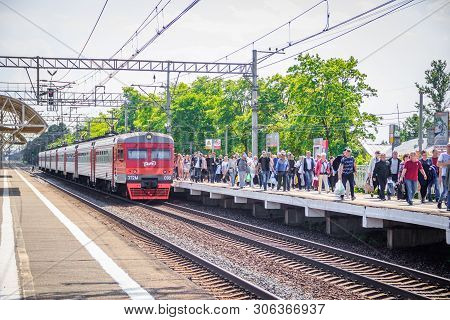 People Got Off The Train. . The Train Has Arrived. People Walk On The Platform. Russia, Leningrad Re