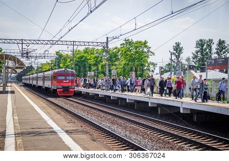 People Got Off The Train. . The Train Has Arrived. People Walk On The Platform. Russia, Leningrad Re