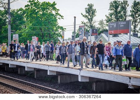 People Got Off The Train. . The Train Has Arrived. People Walk On The Platform. Russia, Leningrad Re