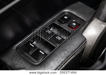 Novosibirsk, Russia - June 11, 2019:  Honda Cr-v,  Close-up Of The Side Door Buttons: Window Adjustm