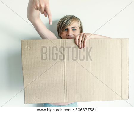 Boy Showing Blank Signboard with Empty Copyspace