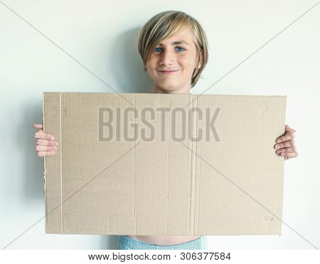 Boy Showing Blank Signboard with Empty Copyspace