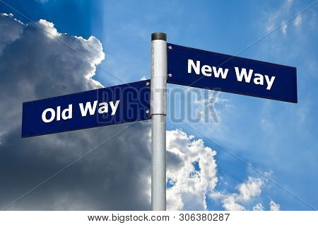 Street Sign In Front Of Dark Clouds Symbolizing Choice Between 'old Way' And 'new Way'