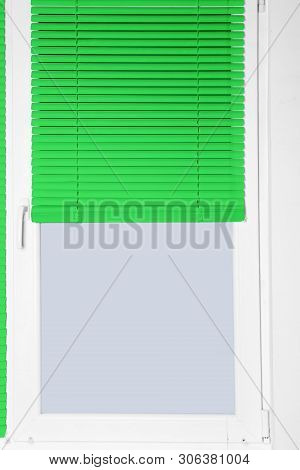 Modern Window With Half-closed Stylish Green Blinds