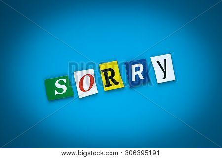 Inscription, Text - Sorry On Blue Background From Colored Letters. Forgiveness Concept. Headline, Ca