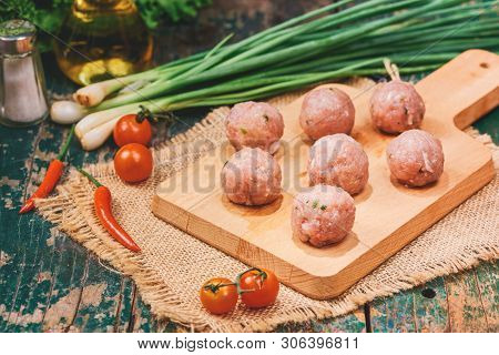 Homemade Food. Raw Fish Ball (uncooked) In The Kitchen With Vegetables