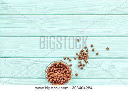 Cereals, Oatflakes And Cornflakes For Healthy Breakfast On Mint Wooden Background Top View Mock Up