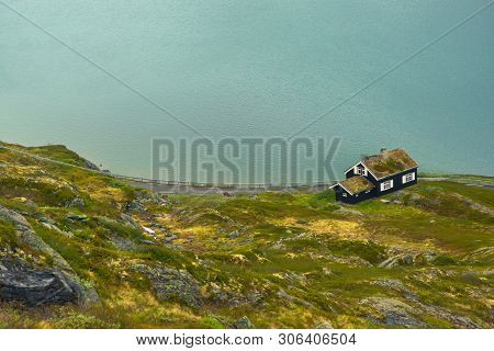 House With Grass Roofs On The Slopes Of Mountains Near Djupvatnet Lake In Norway. Norwegian Houses I