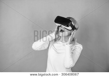 Woman Using Virtual Reality Headset. The Woman With Glasses Of Virtual Reality. Woman Wearing Virtua