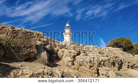 Ancient Ruins Of Kourion City Near Pathos And Limassol, Cyprus. Lighthouse Under The Blue Sky. Trave