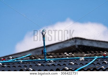 Install The Sprinkler On The Tile Roof To Reduce The Temperature Inside The Building Of House. Sprin